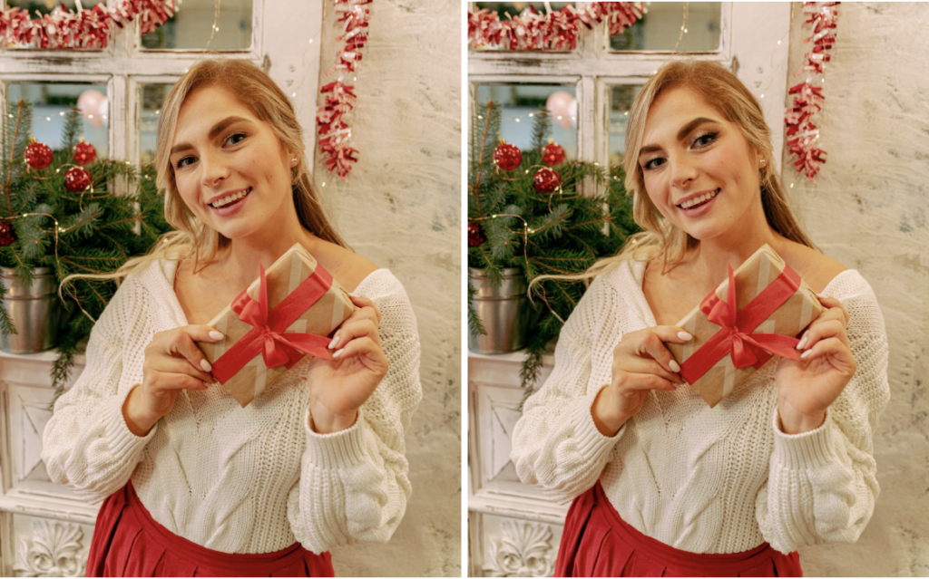Blonde woman dressed in a white top and red skirt holding a Christmas gift in front of holiday decorations