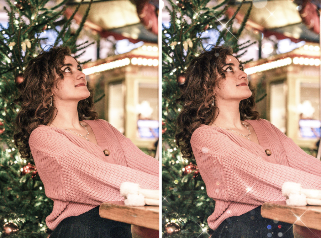 Woman wearing a pink sweater standing on front of a Christmas tree