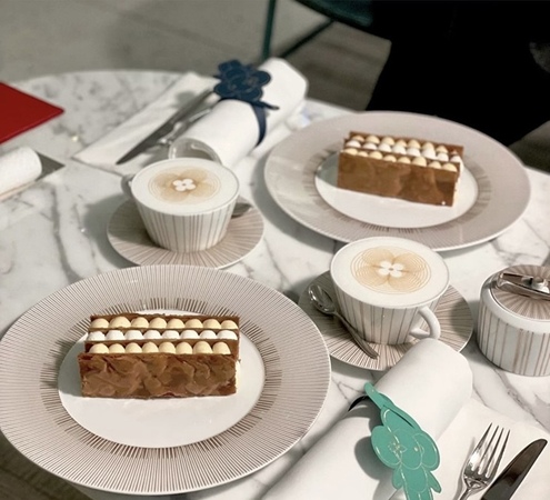 a table with plates of food and utensils